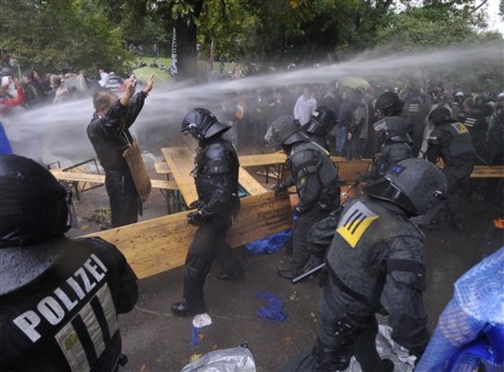 A demonstrator faces police at a protest against a disputed railway project in Stuttgart, Germany on Thursday. Police spokesman Fritz Erlach said 1,500 to 2,000 protesters came out for the demonstration, which also drew several hundred officers. Erlach had no information about whether anybody was injured, but German news agency DAPD reported clashes with police left dozens slightly hurt.